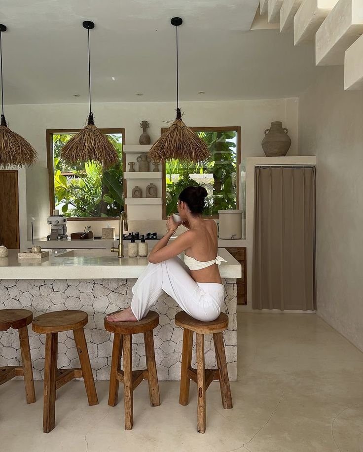Bright villa kitchen with rattan pendant lights